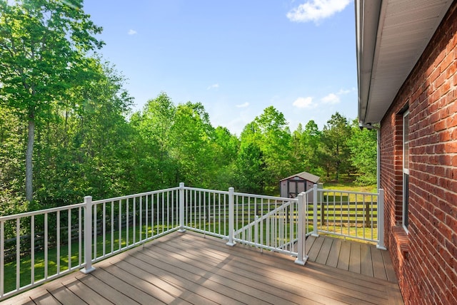 204 Commanche Dr, Hohenwald, TN 38462 - deck featuring a shed and an outbuilding