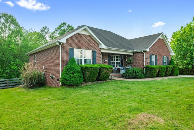 204 Commanche Dr, Hohenwald, TN 38462 - ranch-style home with brick siding, fence, and a front yard