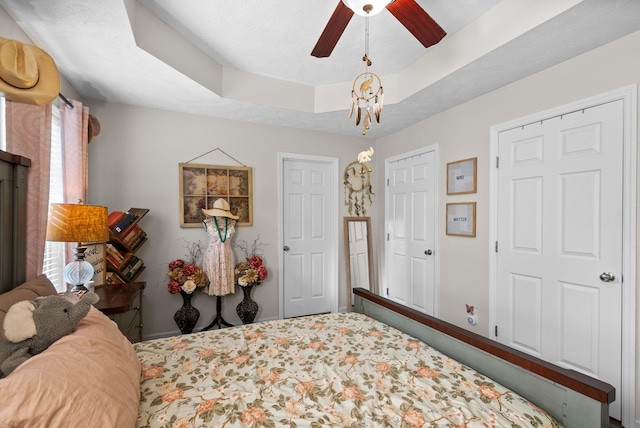 204 Commanche Dr, Hohenwald, TN 38462 - carpeted bedroom featuring baseboards, ceiling fan, and a tray ceiling