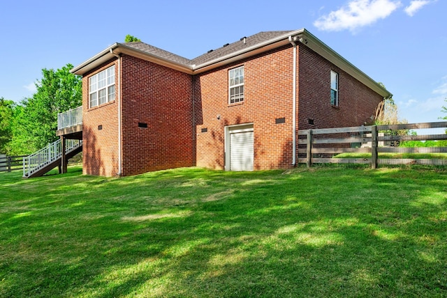204 Commanche Dr, Hohenwald, TN 38462 - back of house featuring fence, a wooden deck, stairway, and brick siding