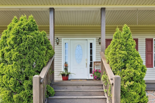 doorway to property featuring covered porch