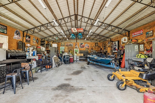garage with a workshop area and metal wall
