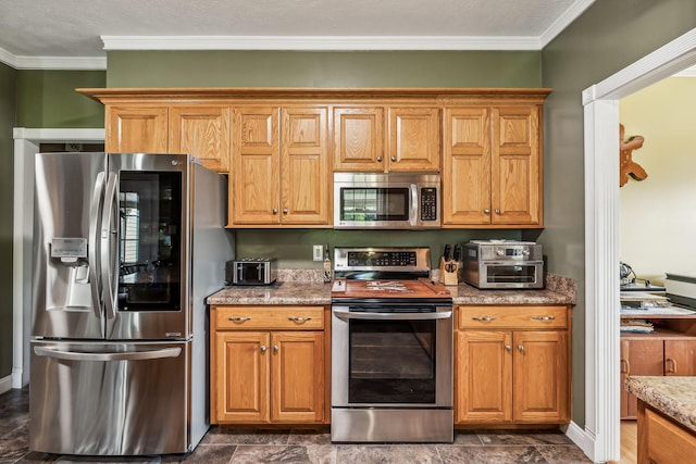 kitchen featuring stainless steel appliances, brown cabinets, crown molding, and light stone counters