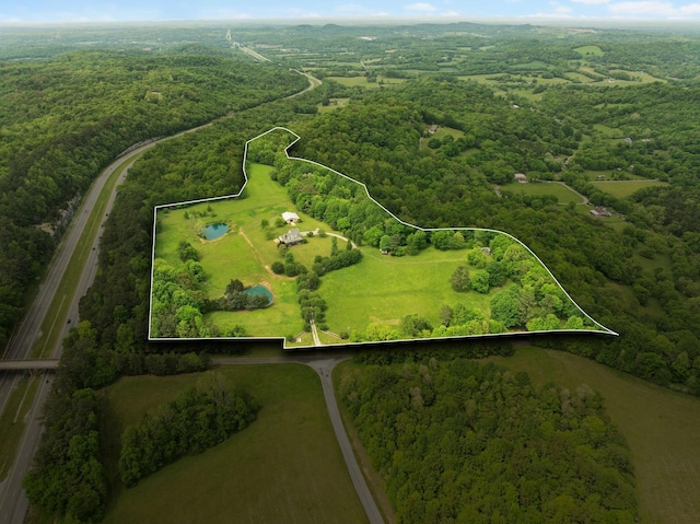 aerial view featuring a view of trees