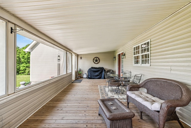 wooden terrace with outdoor dining area