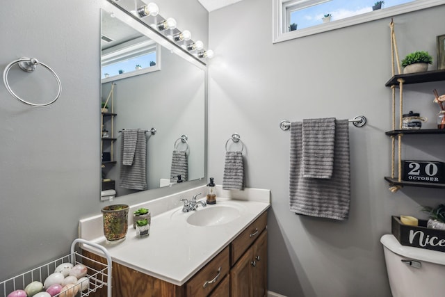 bathroom with vanity and toilet