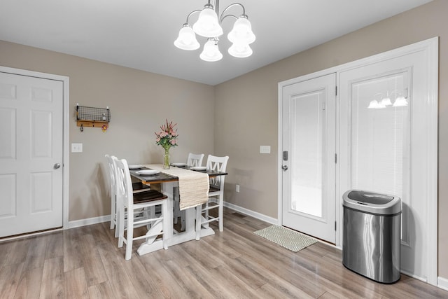 1356 Sayles Cir, Lawrenceburg, TN 38464 - dining room with baseboards, visible vents, a notable chandelier, and light wood-style floors