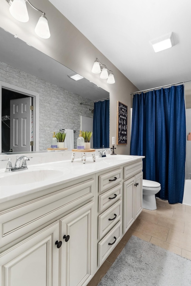 1356 Sayles Cir, Lawrenceburg, TN 38464 - full bathroom featuring toilet, double vanity, a sink, and tile patterned floors