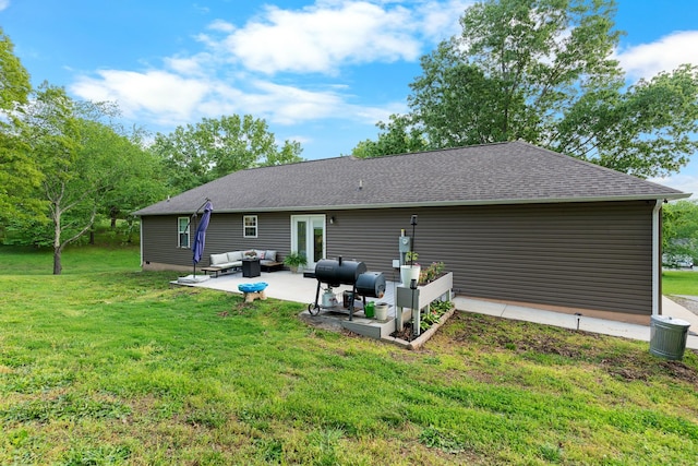 1356 Sayles Cir, Lawrenceburg, TN 38464 - back of property with an outdoor living space, roof with shingles, a yard, and a patio area