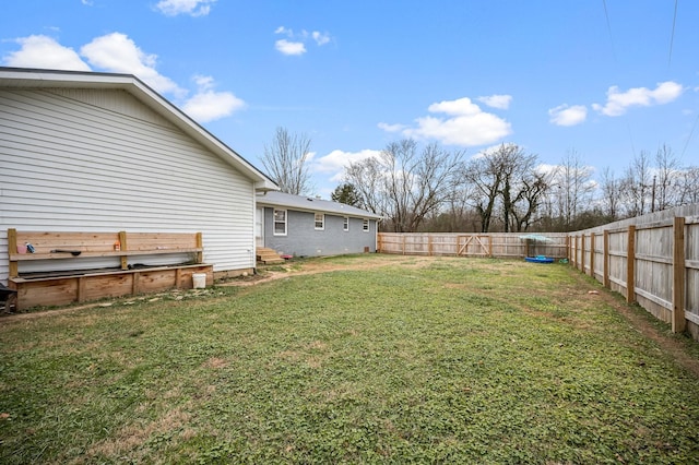 view of yard with a fenced backyard