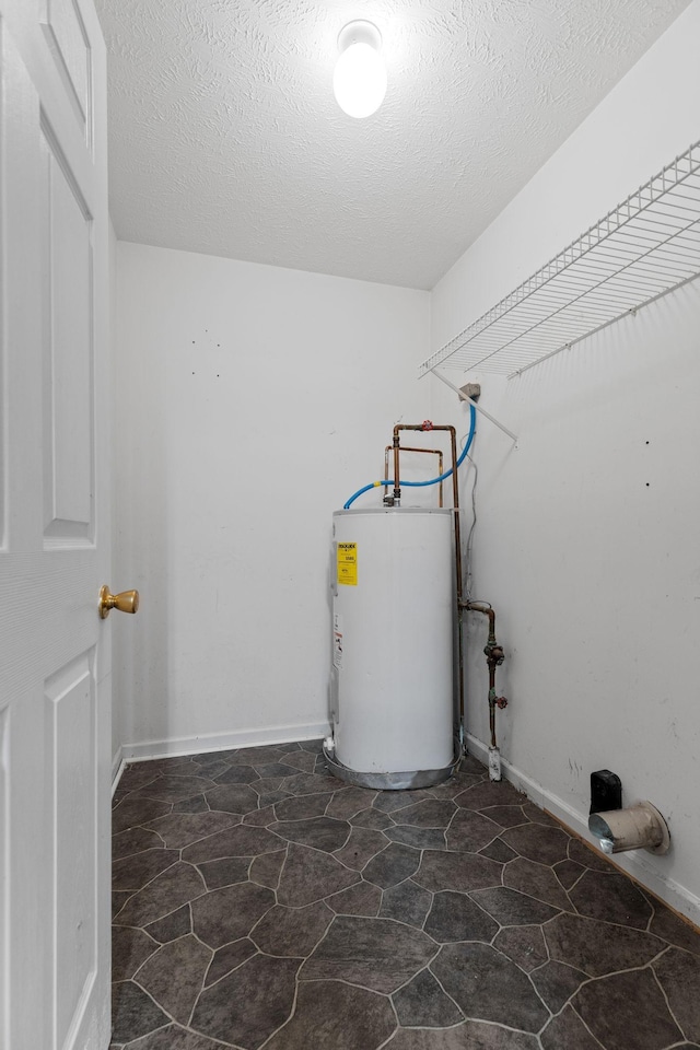 utility room featuring electric water heater
