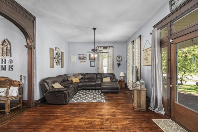 living area featuring wood finished floors and ceiling fan