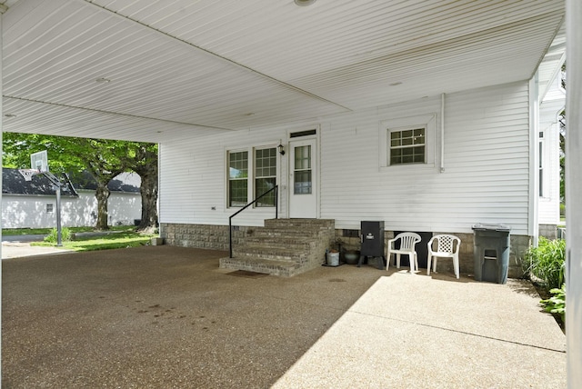 view of patio / terrace featuring an attached carport and entry steps