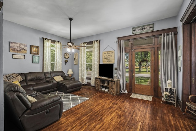 living area featuring wood finished floors and ceiling fan