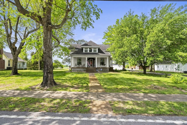 view of front facade with a porch and a front lawn