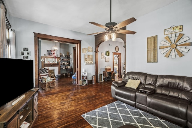 living room featuring wood finished floors and a ceiling fan