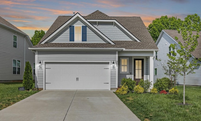 265 Cornice Dr, La Vergne, TN 37086 - view of front facade featuring a lawn, driveway, a shingled roof, and a garage