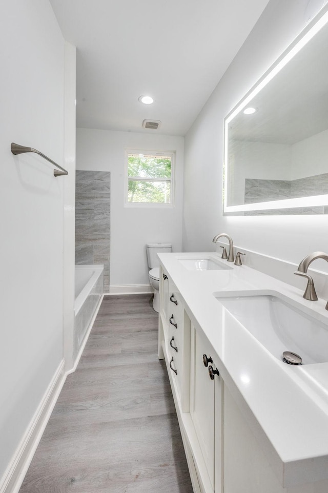 117 Apollo Ct W, Antioch, TN 37013 - bathroom with visible vents, double vanity, toilet, recessed lighting, and a sink