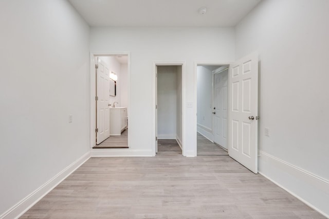 117 Apollo Ct W, Antioch, TN 37013 - unfurnished bedroom featuring baseboards, ensuite bath, and light wood-style flooring
