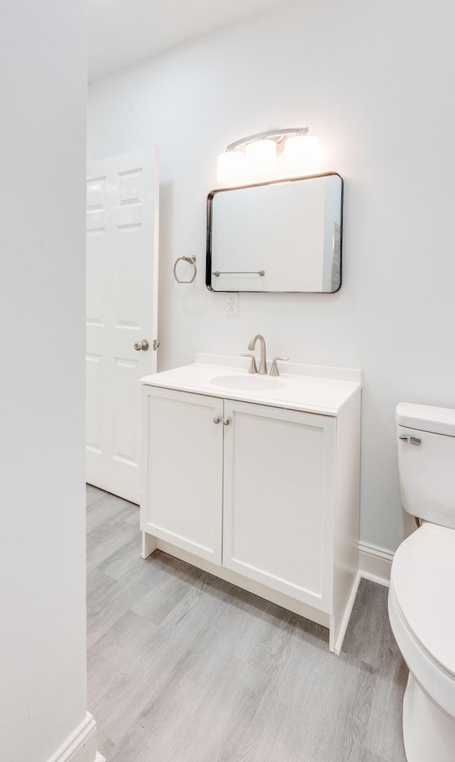 117 Apollo Ct W, Antioch, TN 37013 - half bath with toilet, baseboards, wood finished floors, and vanity