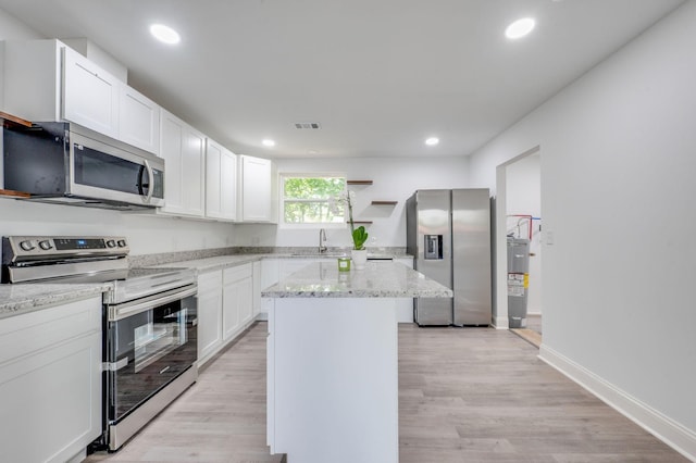 117 Apollo Ct W, Antioch, TN 37013 - kitchen featuring visible vents, light stone countertops, white cabinetry, a sink, and stainless steel appliances