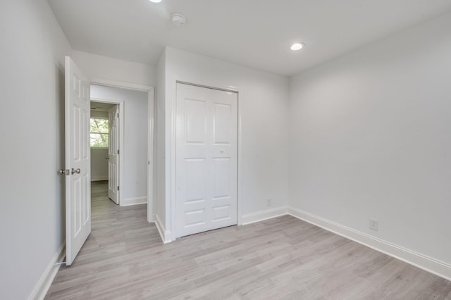 117 Apollo Ct W, Antioch, TN 37013 - unfurnished bedroom featuring a closet, baseboards, recessed lighting, and light wood-type flooring