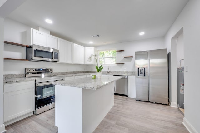 117 Apollo Ct W, Antioch, TN 37013 - kitchen featuring open shelves, appliances with stainless steel finishes, light stone counters, white cabinetry, and visible vents