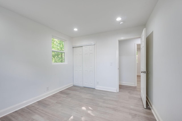 117 Apollo Ct W, Antioch, TN 37013 - unfurnished bedroom with a closet, baseboards, recessed lighting, and light wood-style floors