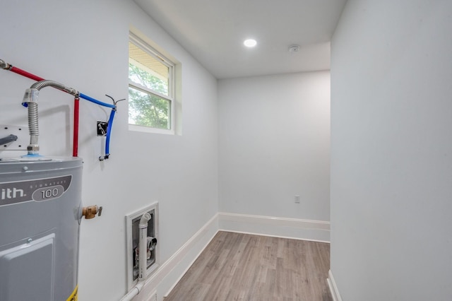 117 Apollo Ct W, Antioch, TN 37013 - laundry area with baseboards, recessed lighting, water heater, and wood finished floors