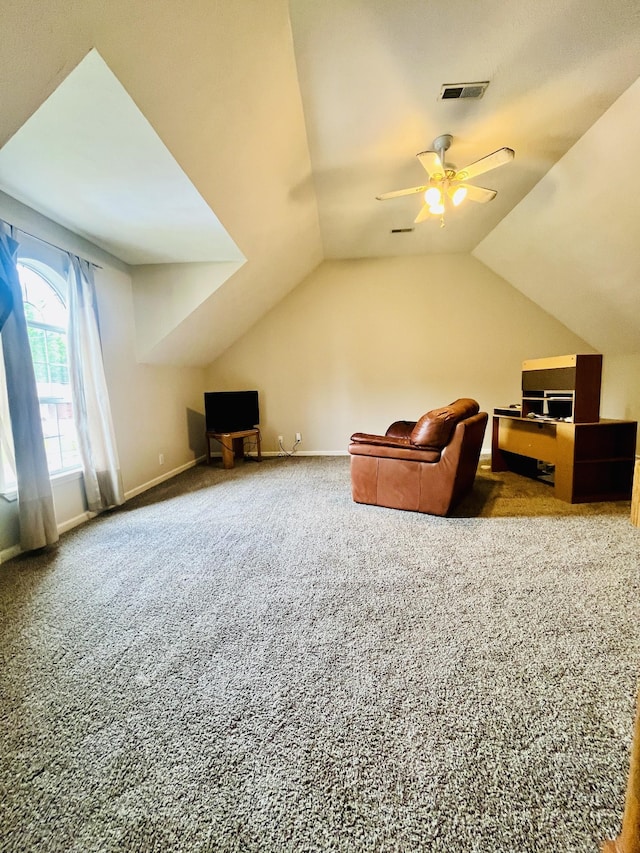 additional living space with lofted ceiling, visible vents, a ceiling fan, and carpet floors