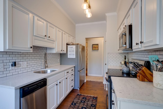 231 Westchase Dr, Nashville, TN 37205 - kitchen with a sink, stainless steel appliances, decorative backsplash, crown molding, and white cabinetry