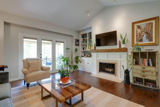 231 Westchase Dr, Nashville, TN 37205 - living area featuring a fireplace, built in features, vaulted ceiling, baseboards, and wood finished floors