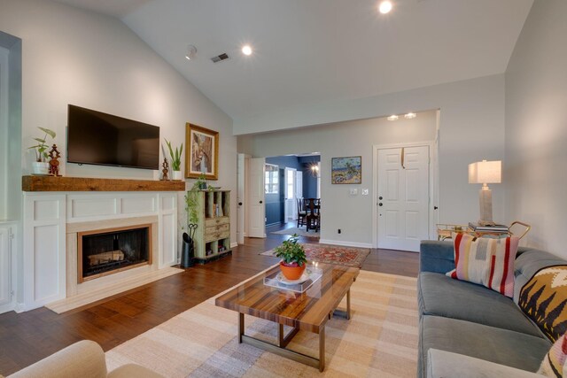 231 Westchase Dr, Nashville, TN 37205 - living room featuring a fireplace with flush hearth, visible vents, recessed lighting, wood finished floors, and high vaulted ceiling