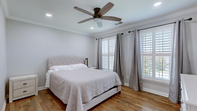 bedroom with recessed lighting, visible vents, light wood-style flooring, baseboards, and ornamental molding
