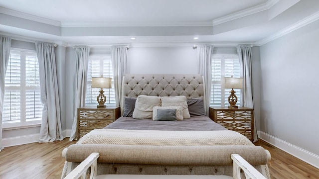 bedroom with multiple windows and baseboards
