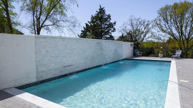 view of pool featuring a patio and a fenced in pool