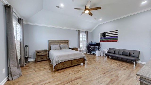 bedroom featuring lofted ceiling, crown molding, light wood finished floors, and baseboards