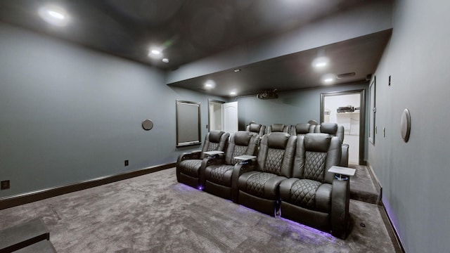 carpeted home theater room featuring baseboards and recessed lighting