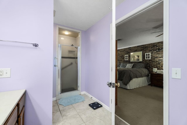bathroom featuring a shower stall, ensuite bathroom, baseboards, vanity, and a ceiling fan