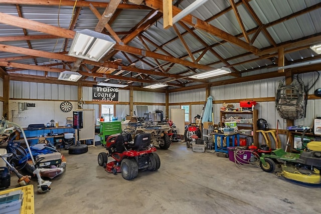 garage with a workshop area and metal wall
