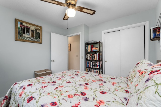 bedroom with a ceiling fan and a closet