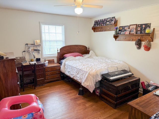 bedroom featuring wood finished floors and ceiling fan