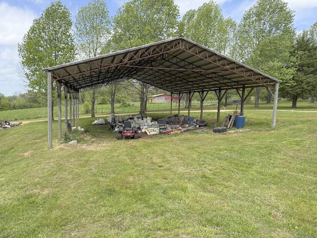 view of home's community featuring a detached carport and a yard