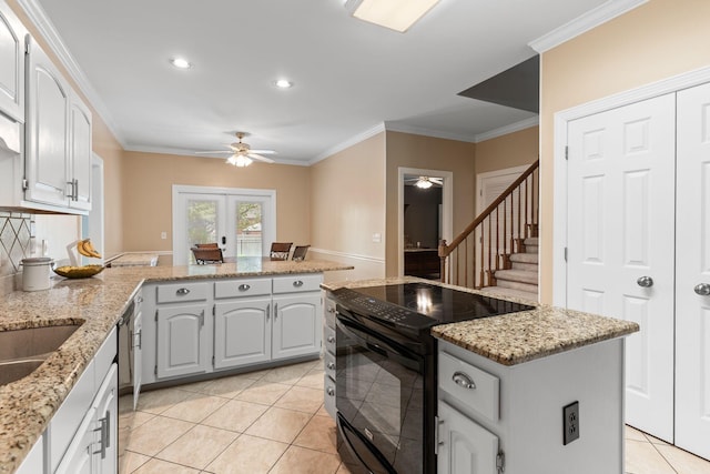 kitchen with light tile patterned floors, crown molding, a ceiling fan, and black appliances