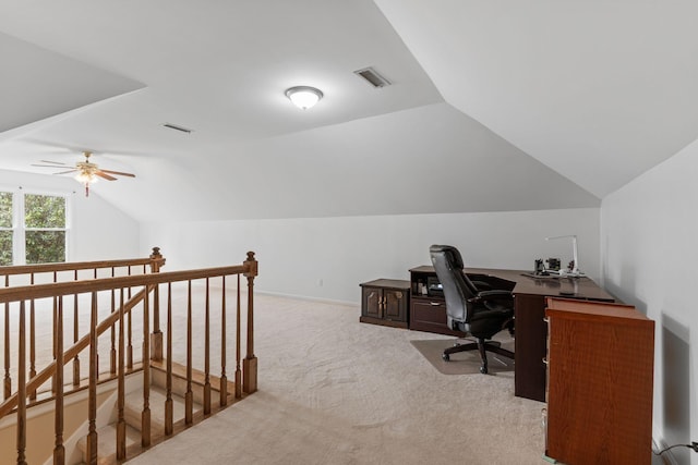 carpeted office featuring ceiling fan, lofted ceiling, and visible vents