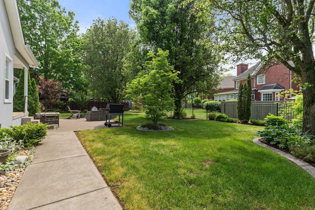 view of yard with a fenced backyard and a patio area