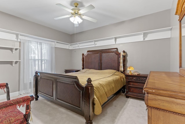 bedroom featuring ceiling fan and light carpet