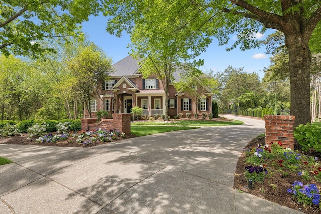 3045 Flagstone Dr, Franklin, TN 37069 - view of front facade with a standing seam roof, brick siding, and metal roof
