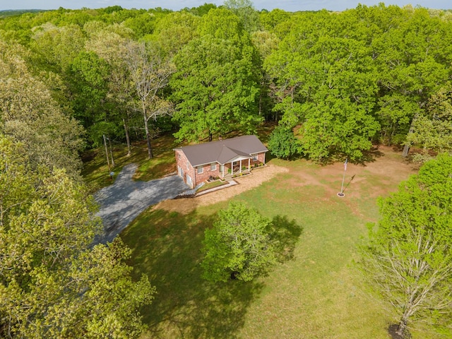 drone / aerial view featuring a forest view