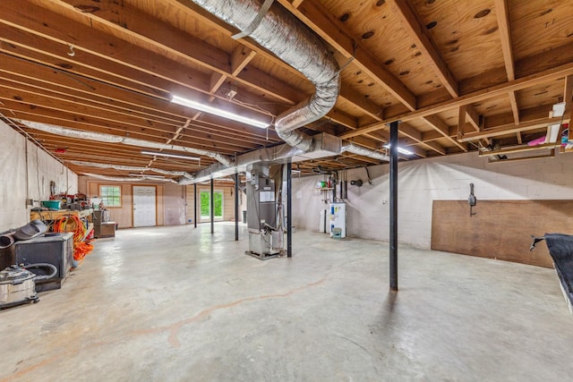 below grade area featuring heating unit and water heater
